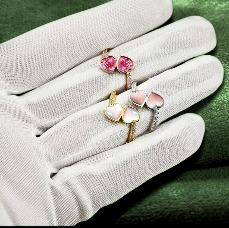 double heart ashes rings with crossover feature on hand