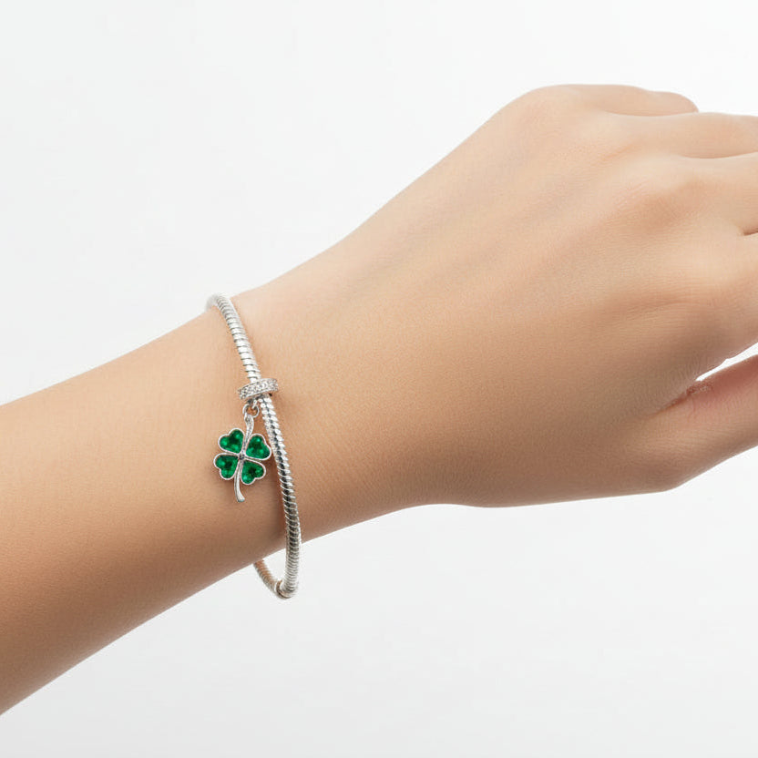 four leaf clover ashes charm to fit pandora bracelets on a models arm