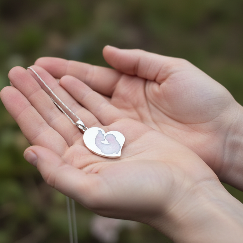 mother child ashes necklace on green velvet background