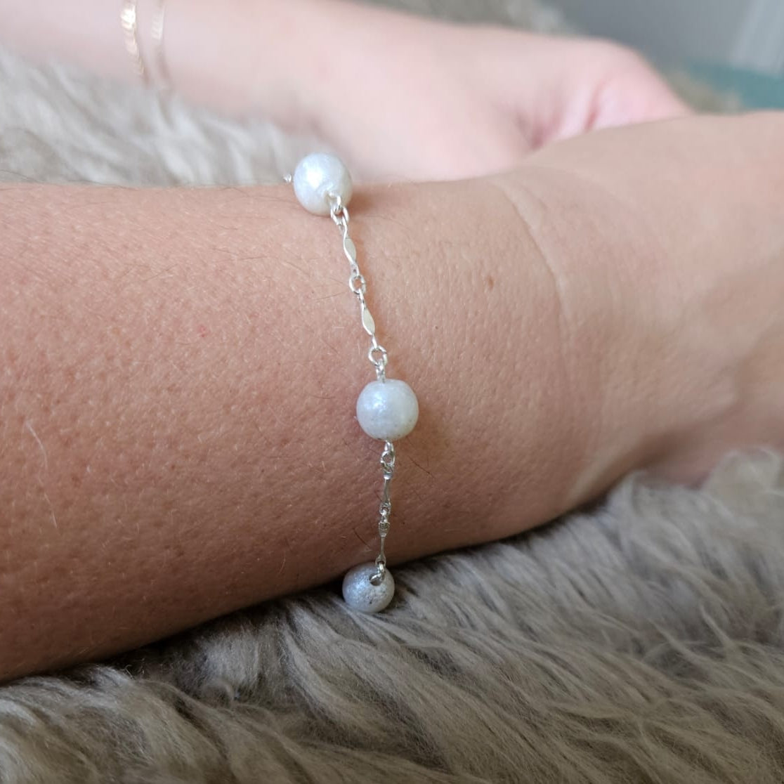 ashes pearl bracelet on model arm