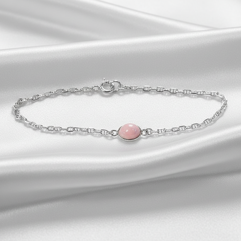 pink opal ashes bracelet on green velvet background