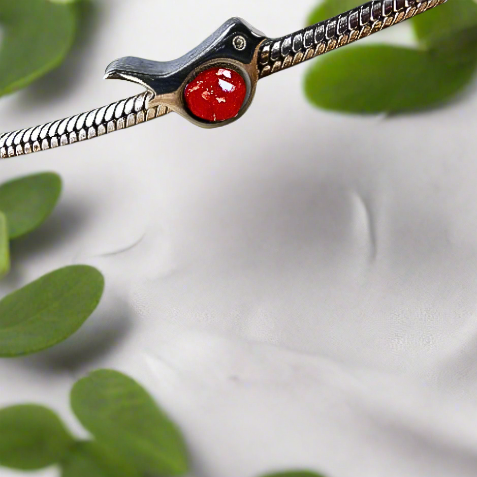 robin ashes charm on bracelet