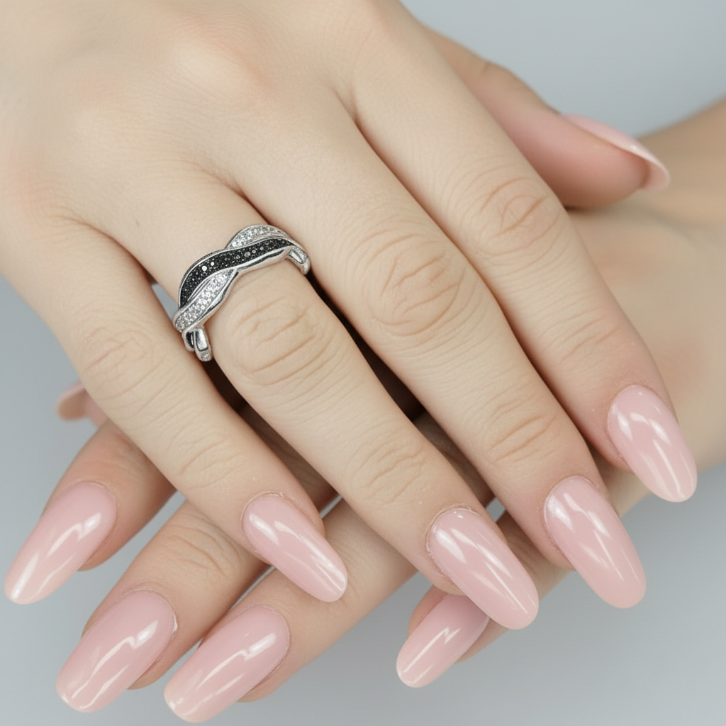 twist eternity ashes ring on hand with pink nails
