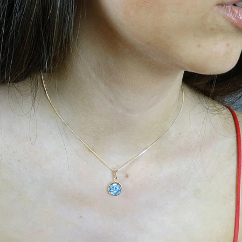 9ct gold round ashes memorial necklace on model