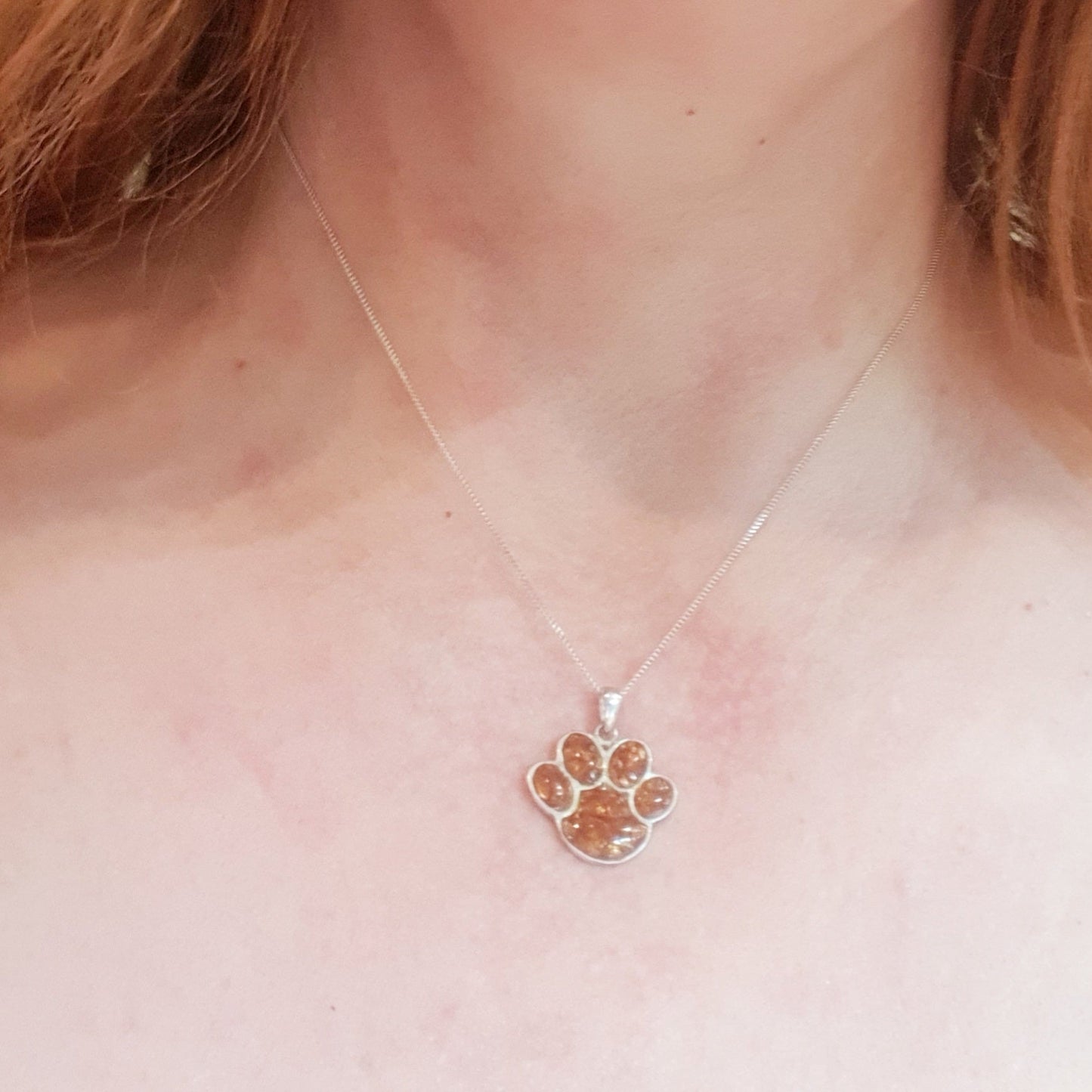 pet ashes memorial pendant on model