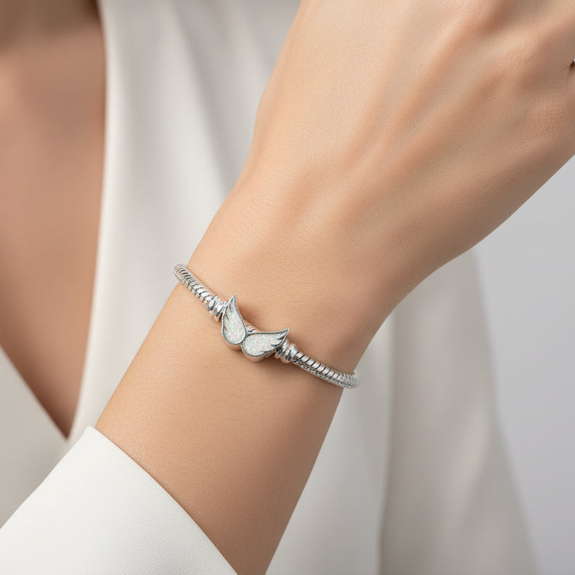 angel wings ashes charm for pandora bracelets on a models arm