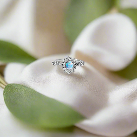 14ct white gold ashes ring with a central gemstone in an art deco vintage crossover design