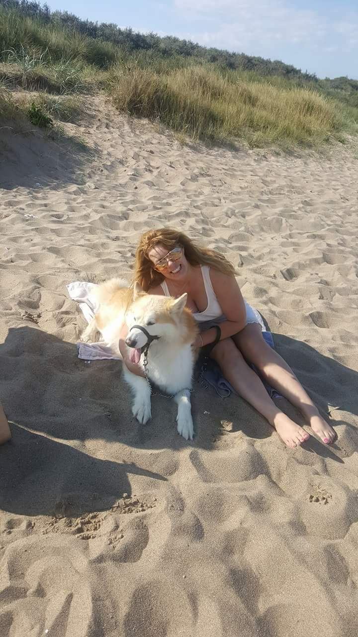 Chan with her dog Anu at the beach