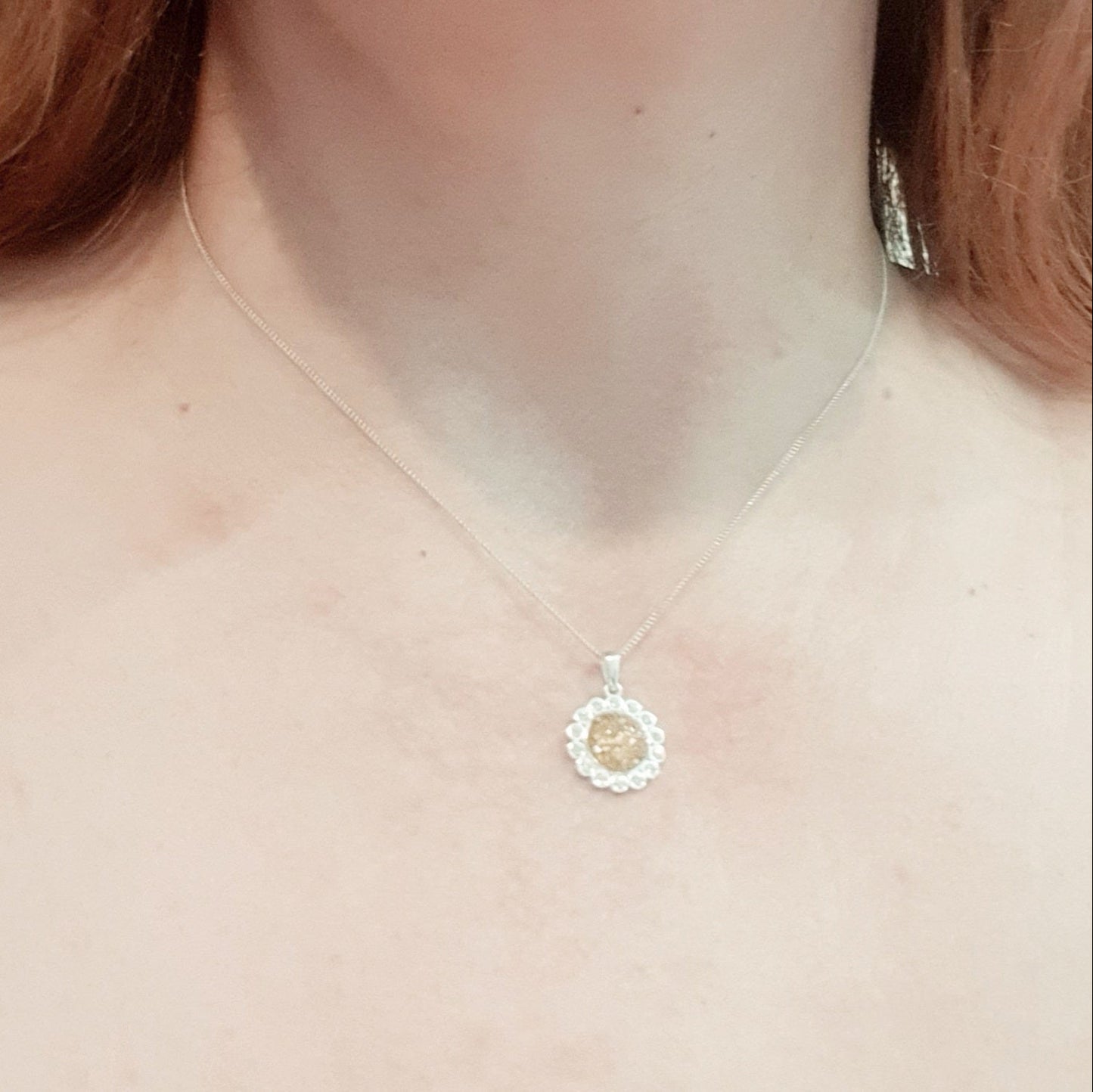 flower halo ashes necklace on model