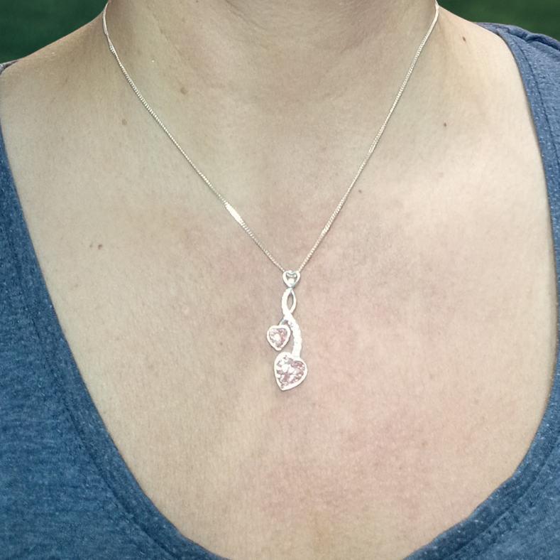 two heart ashes memorial necklace on model