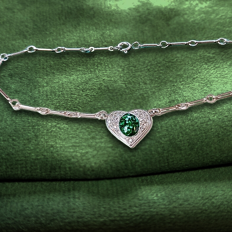 ashes heart bracelet on green velvet background