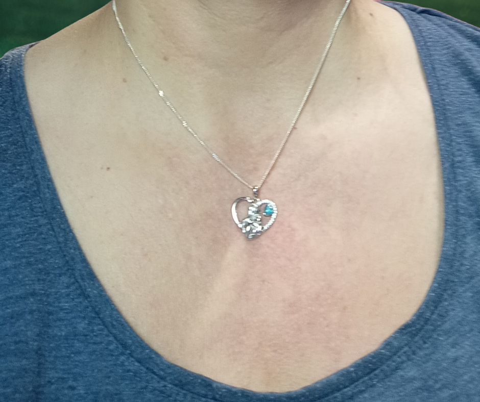 mother baby ashes necklace on model