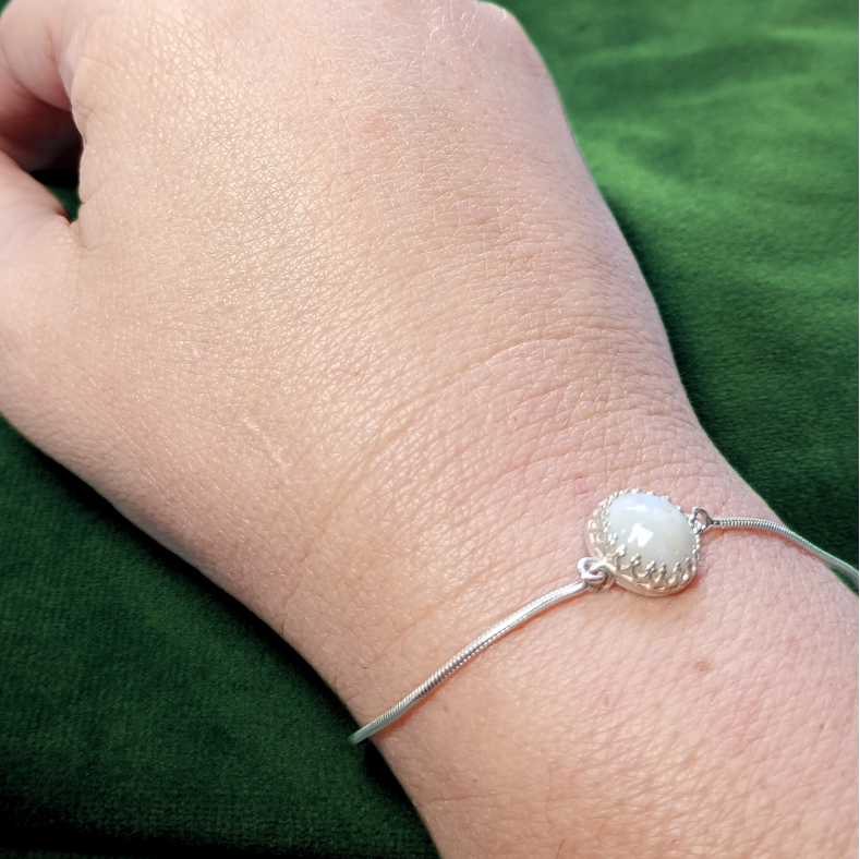 opal ashes bracelet on hand