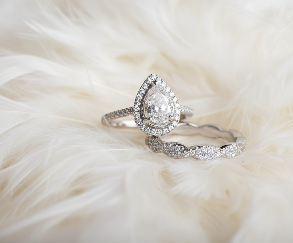 teardrop halo ashes cremation rings with twist on feathers