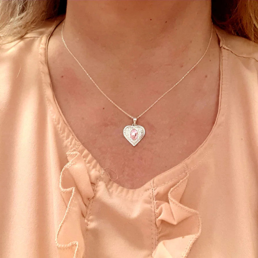 pink opal ashes heart necklace on model