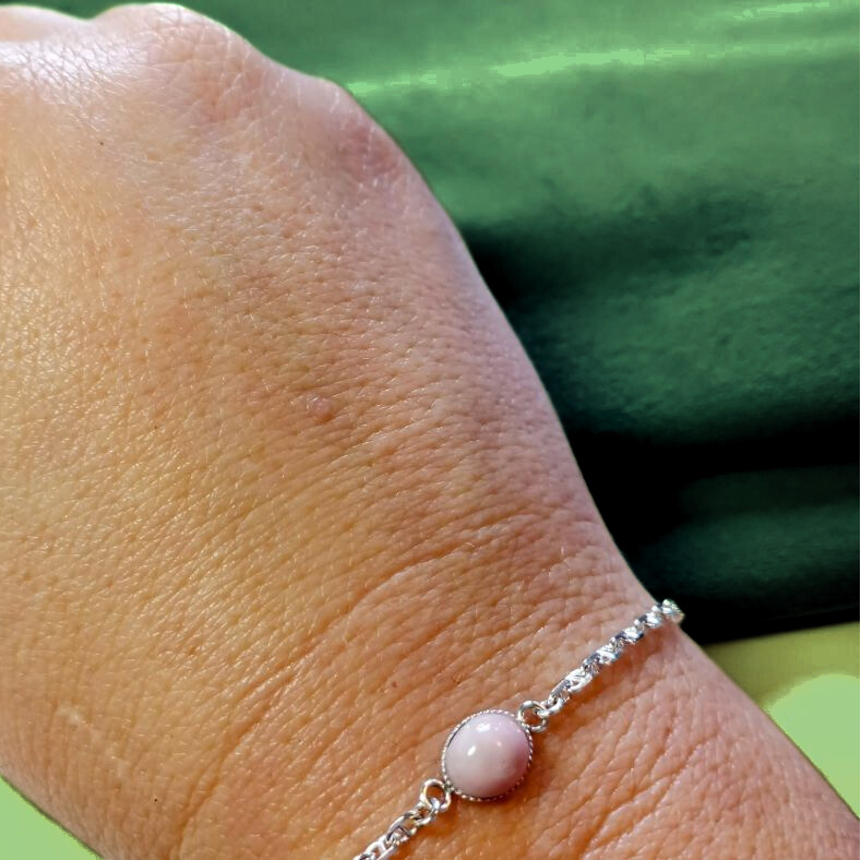 pink opal ashes bracelet on hand