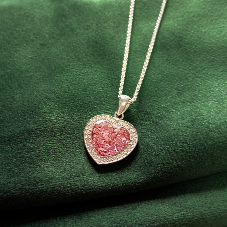 pink topaz ashes memorial heart shaped necklace on green velvet background
