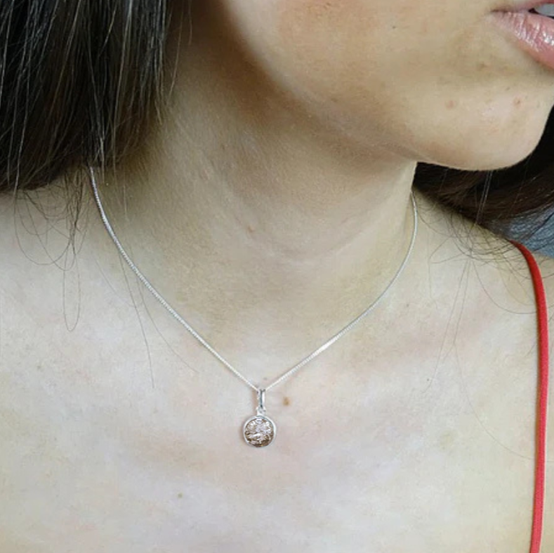 simple round ashes memorial necklace on model