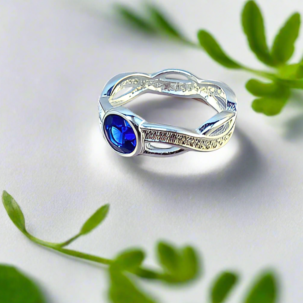 round twist crossover ashes ring with blue stone