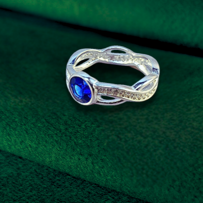 round twist plaited ashes ring with blue sapphire stone