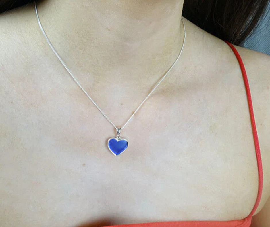 sapphire heart ashes necklace on model