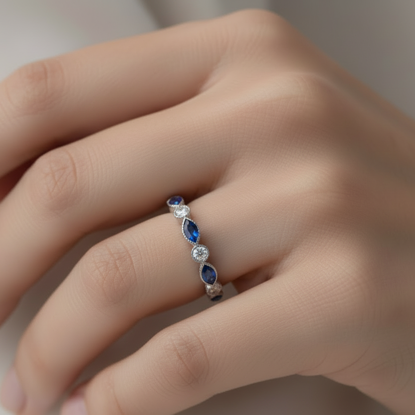 silver ashes memorial ring set with birthstones on a hand