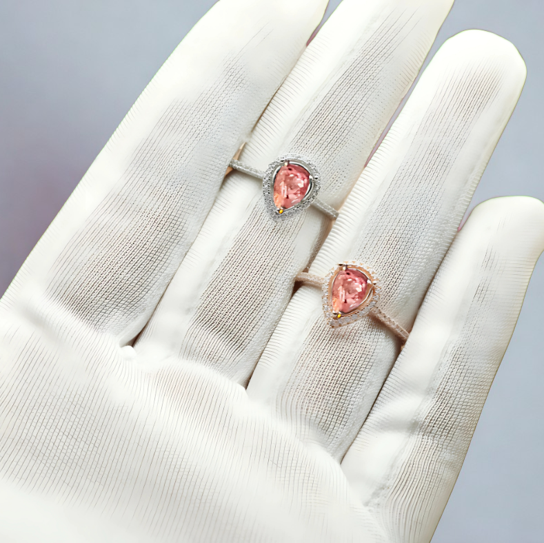 teardrop ashes halo rings in rose gold and silver on hand