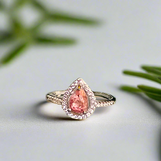 teardrop halo ashes ring in white gold with pink topaz ashes stone