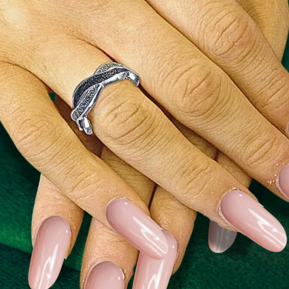 twist eternity ashes ring on hand with pink nails