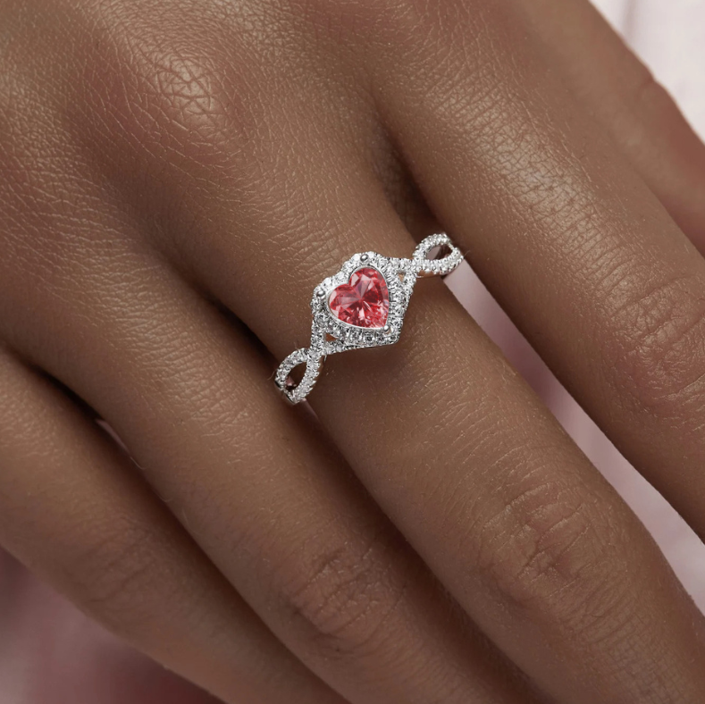 14ct white gold ashes heart ring on hand model