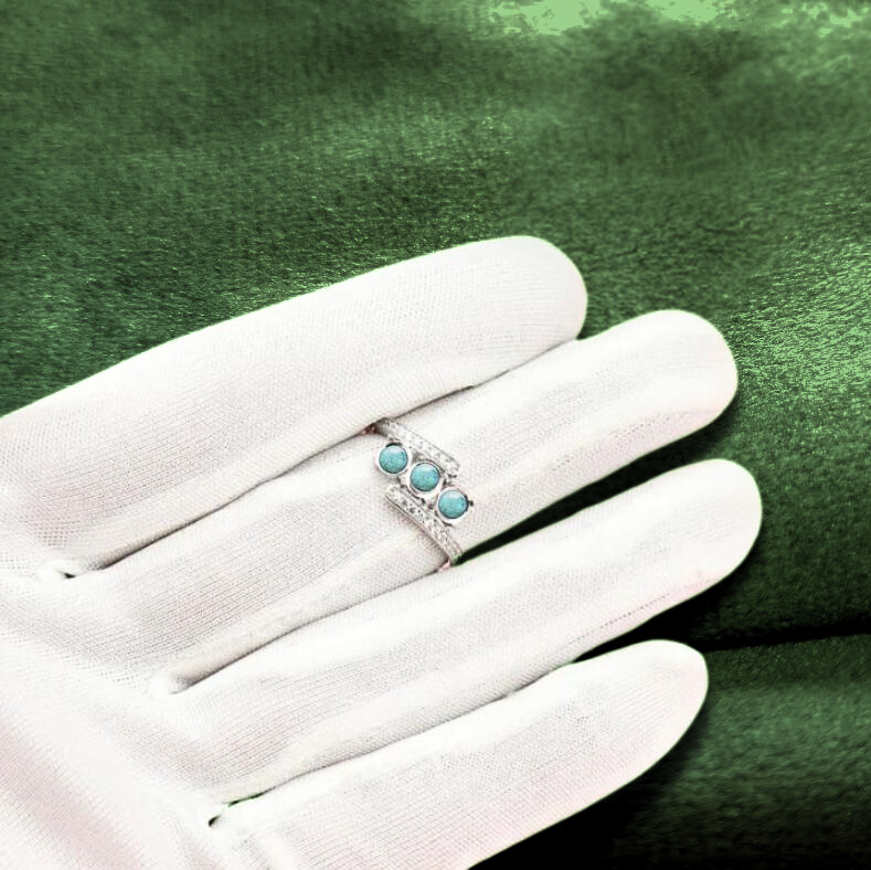 white gold three stone ashes ring on hand model